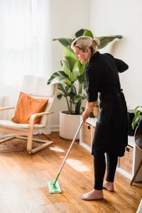 About A Woman Sweeping a Floor